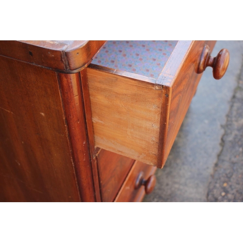 511 - A late 19th century mahogany chest of two short and two long graduated, on bun feet, 39 1/2