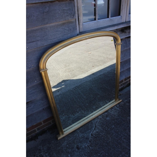 520 - A gilt framed arch top overmantel mirror, 48