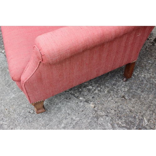 530 - An Edwardian deep seat armchair, on square castored supports