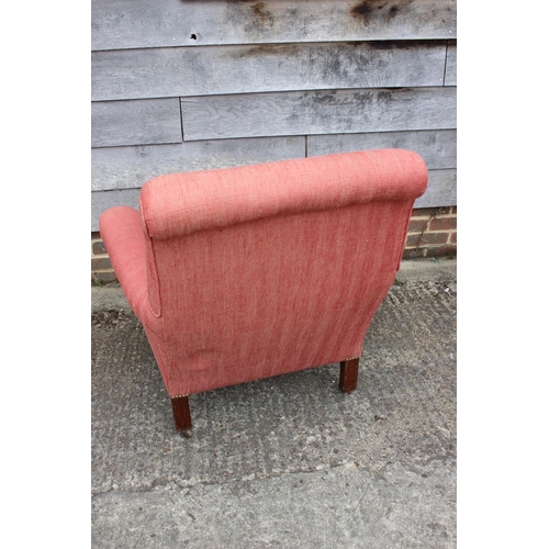 530 - An Edwardian deep seat armchair, on square castored supports