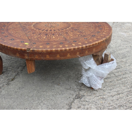 540 - A 1930s geometric inlaid walnut low circular coffee table, on cabriole supports, 33 1/2