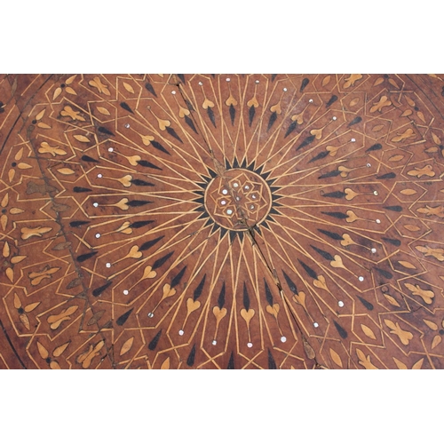 540 - A 1930s geometric inlaid walnut low circular coffee table, on cabriole supports, 33 1/2