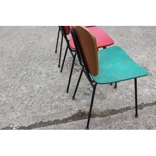 541 - Three 1960s painted padded shaped back and seat dining chairs, on metal supports