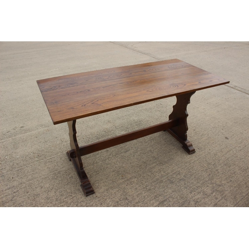 544 - An oak refectory table, on pierced panel end stretchered supports, 45