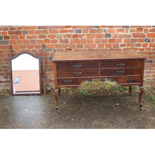 549 - A mahogany dressing table, fitted mirror over two short, one long and two small drawers, with copper... 