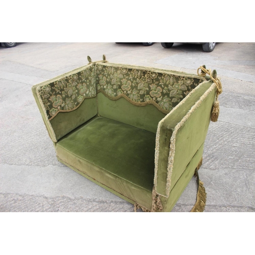 550 - A Knole settee, upholstered in a green velvet with brocaded panels, 66