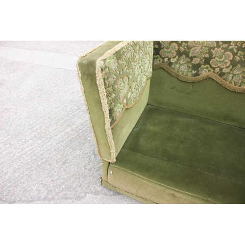 550 - A Knole settee, upholstered in a green velvet with brocaded panels, 66