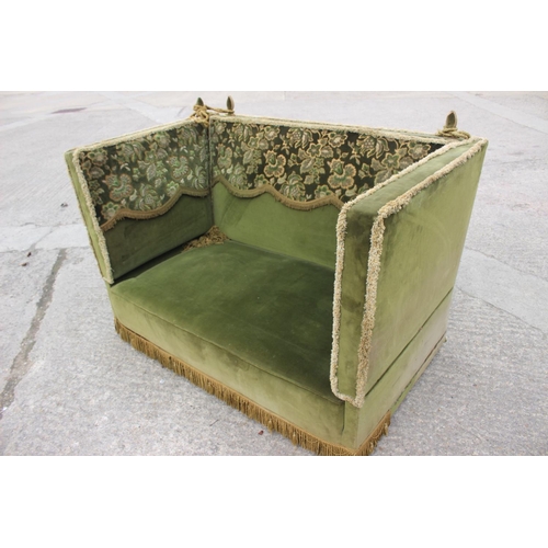 551 - A Knole settee, upholstered in a green velvet with brocaded panels, 66