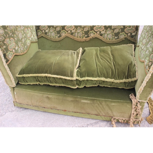 551 - A Knole settee, upholstered in a green velvet with brocaded panels, 66