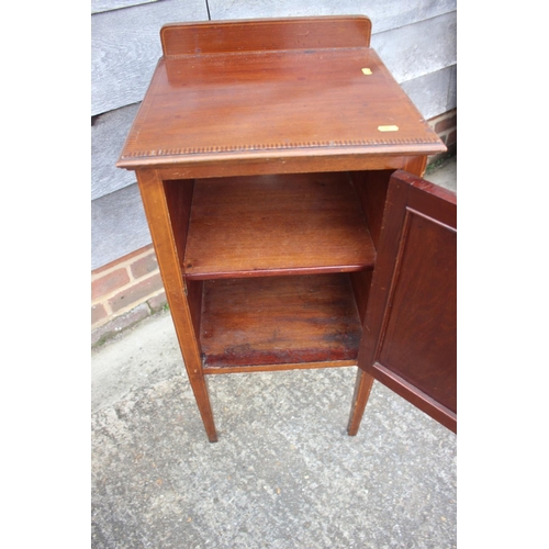 552 - A Maples Edwardian mahogany and box inlaid ledge back bedside cupboard enclosed one door, on square ... 