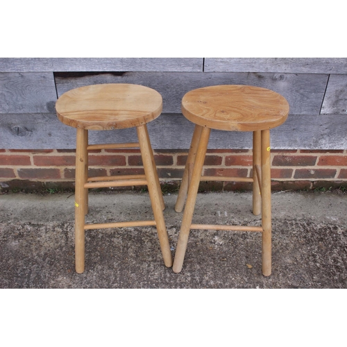 557 - A blue painted towel rail and a pair of beech stools with elm panel seats