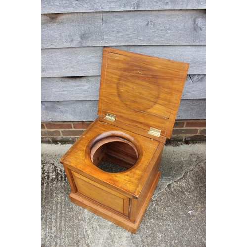 572 - A satin walnut commode stool with panel front, supplied by Fred Fish & Sons, 19