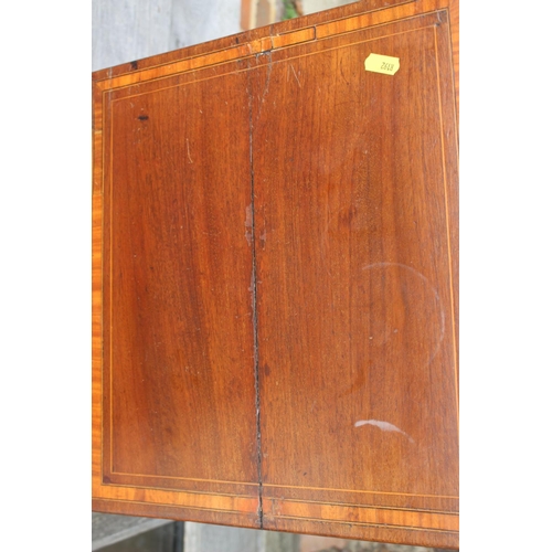 573 - An Edwardian walnut and line inlaid bedside cupboard enclosed one door, on square taper supports, 14... 