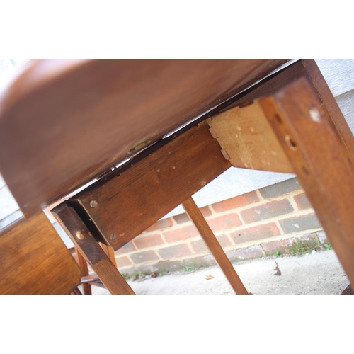 575 - A figured mahogany Sutherland drop leaf table, on square supports and claw and ball feet, 25 1/2