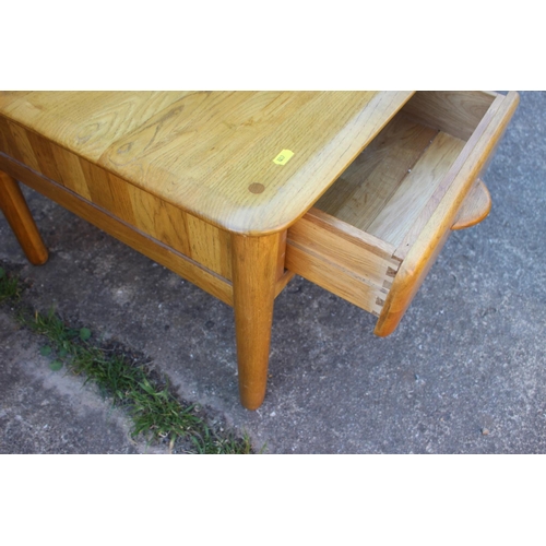 584 - A light oak low coffee table, fitted four shallow drawers, 39