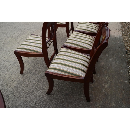 587 - A reproduction polished as mahogany circular  extending dining table with one extra leaf, on faceted... 