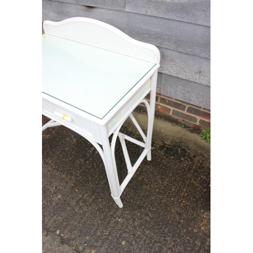 588 - A white painted ledge back dressing table, fitted two drawers, 31