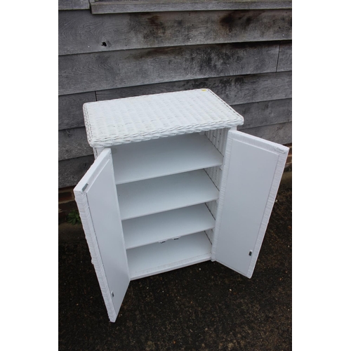 588 - A white painted ledge back dressing table, fitted two drawers, 31