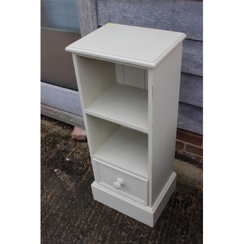 599 - A cream painted pine side unit, fitted two open shelves over one drawer, 15