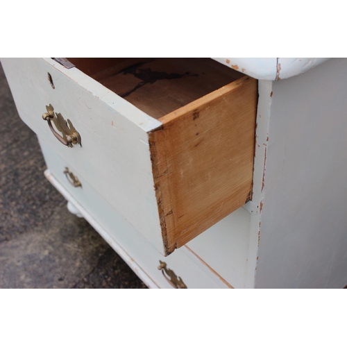 600 - A Victorian cream painted pine chest of two short and two long drawers, on turned supports, 33