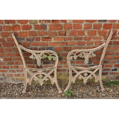 614 - A pair of 19th century cast iron scroll work bench ends, 33