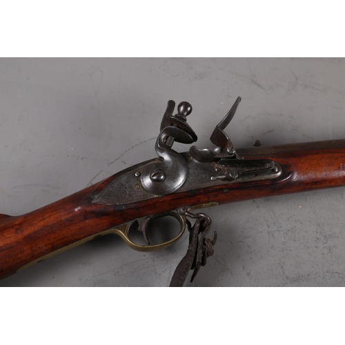 173 - An East India Company early 19th century flintlock musket, the lock stamped J Manton, barrel 33 3/4