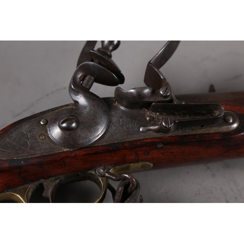 173 - An East India Company early 19th century flintlock musket, the lock stamped J Manton, barrel 33 3/4