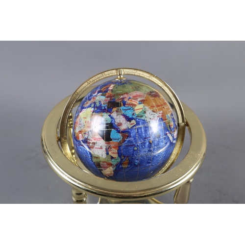 208 - A table top terrestrial globe, set specimen hard stones, in gilt frame