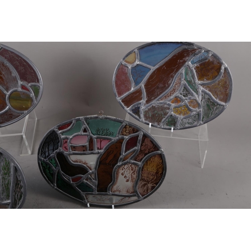 219 - Lynne Claydon, a set of four William Morris style leaded stained glass oval shaped panels, depicting... 