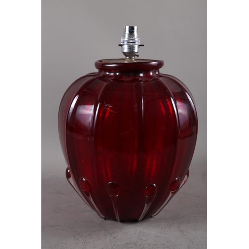 234 - A cranberry coloured glass bulbous table lamp, 13