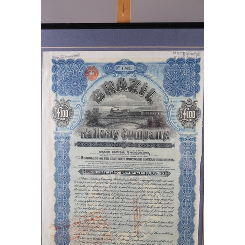 246 - A Brazil Railway Company £100 share certificate, in ebonised strip frame