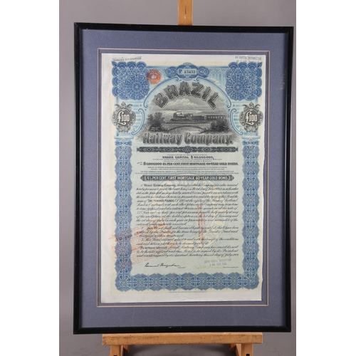 246 - A Brazil Railway Company £100 share certificate, in ebonised strip frame