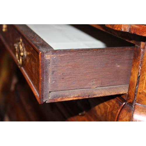 437 - A late 19th century Dutch figured walnut marquetry bombe display cabinet, the upper section enclosed... 