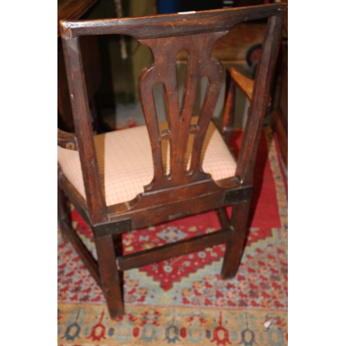 440 - A late 18th century oak and chestnut elbow chair with panel seat and pierced splat back, on chamfere... 