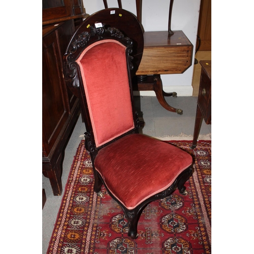 459 - A late 19th century carved showframe nursing chair, upholstered in a rust velour, on cabriole suppor... 