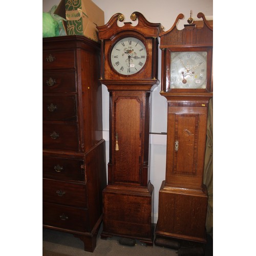 518 - An early 19th century oak and mahogany banded provincial long case clock with painted circular dial ... 