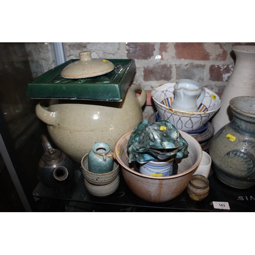 103 - A quantity of studio pottery, including a frog, three teapots, plates, bowls, jugs and other items