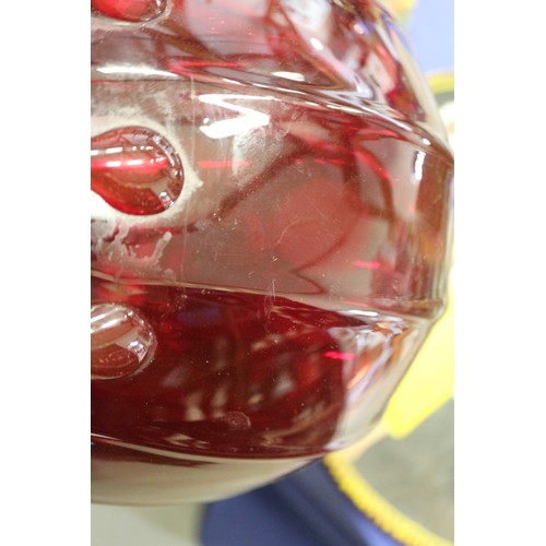 234 - A cranberry coloured glass bulbous table lamp, 13