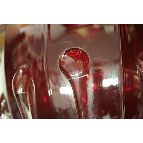 234 - A cranberry coloured glass bulbous table lamp, 13