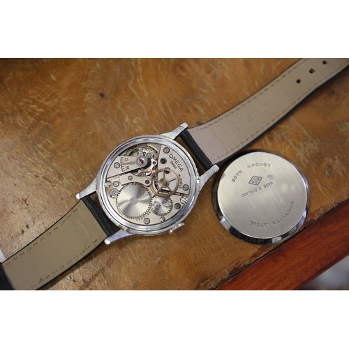 294 - A gentleman's vintage Omega wristwatch, in London made British Watch Company chrome and stainless st... 