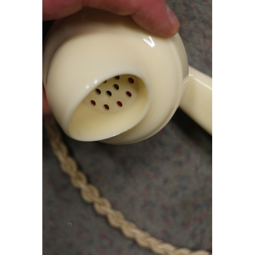 125 - A 200 series cream Bakelite telephone with wall 