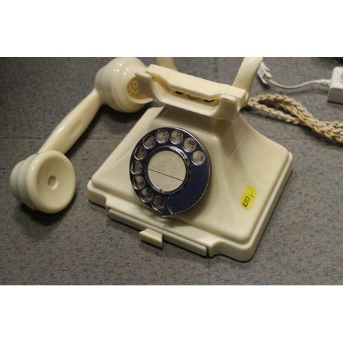 125 - A 200 series cream Bakelite telephone with wall 