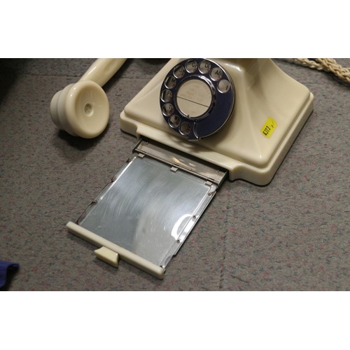 125 - A 200 series cream Bakelite telephone with wall 