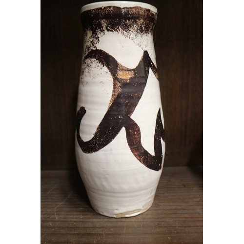 65 - Ray Marshall (Canadian 1913-1986): a vintage brown stoneware slender vase of typical striped sgraffi... 