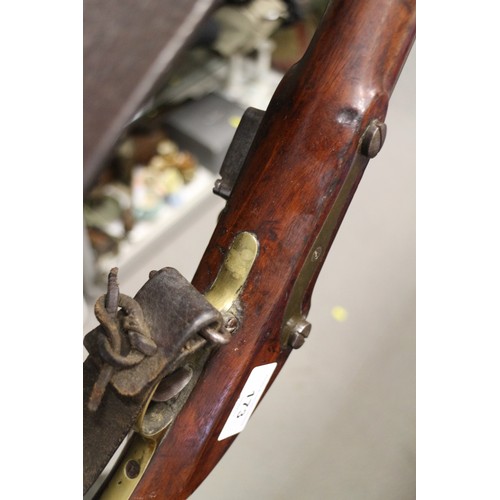 173 - An East India Company early 19th century flintlock musket, the lock stamped J Manton, barrel 33 3/4