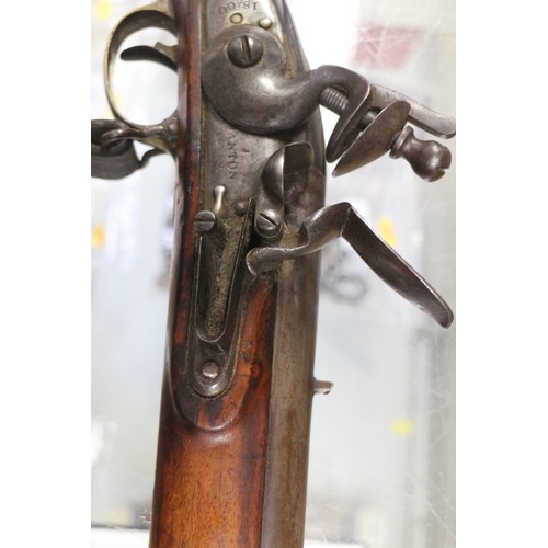 173 - An East India Company early 19th century flintlock musket, the lock stamped J Manton, barrel 33 3/4