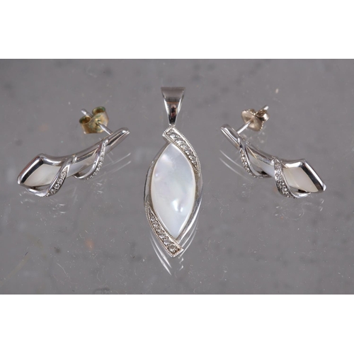 397 - A Kabana diamond and mother-of-pearl pendant, stamped 14k, and a pair of matching drop earrings