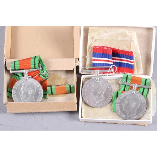 423 - Three WWII medals with card boxes to Mr S W F Johnson and Mrs Margaret H Johnson