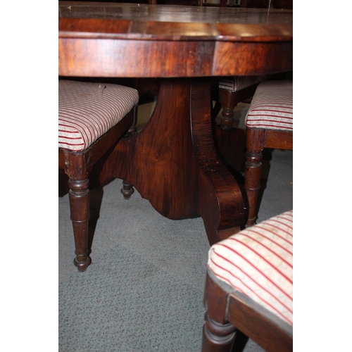 556 - A 19th century Continental rosewood serpentine shape tilt top loo table, on triform column and splay... 