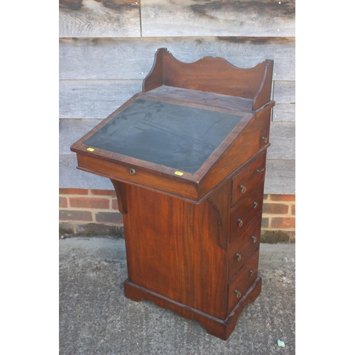 572 - A late 19th century walnut Davenport type desk, with raised back over writing slope, pull-out pen dr... 